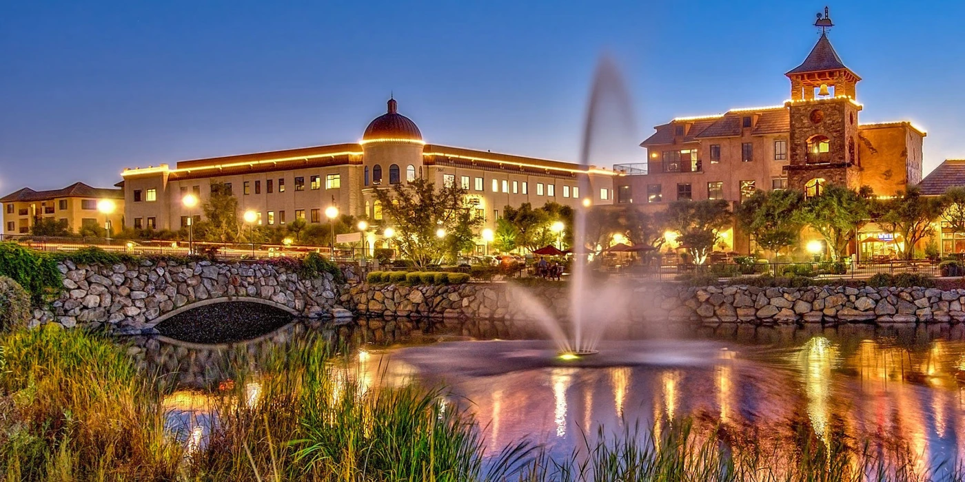 El Dorado Hills Town Center lake, fountain and illuminated commercial buildings