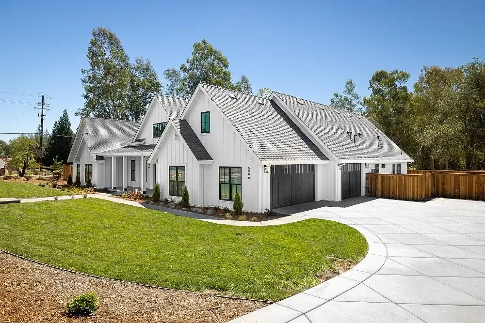 Parcel 1 user-supplied finished-home reference — exterior and garage approach
